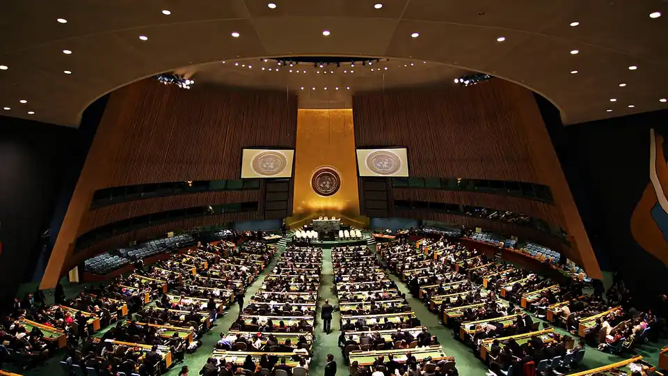 The General Assembly Hall at UN Headquarters in New York, with delegates seated at their desks