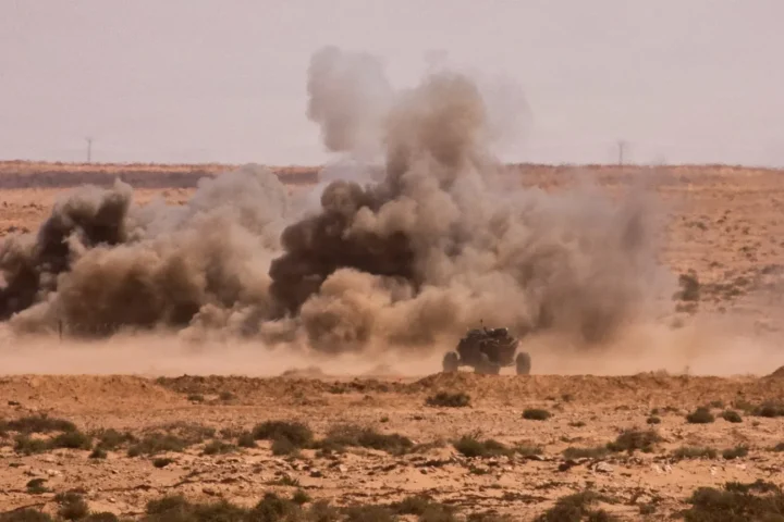 An unmanned ground vehicle and smoke during African Lion 26 robotic breach training in Morocco on May 4, 2026