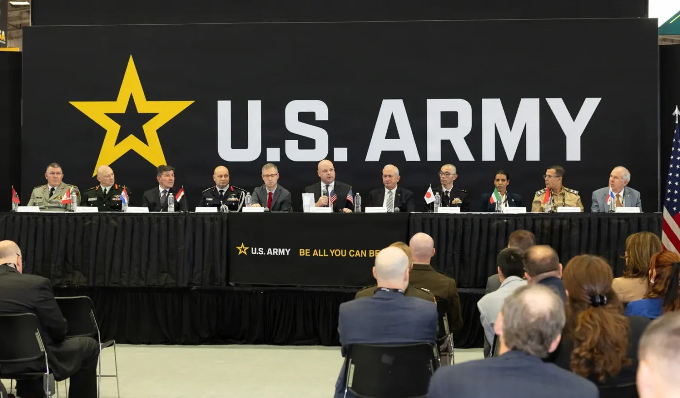 Deputy Under Secretary of the Army Adam Telle with representatives of eight countries at the signing ceremony at AUSA 2026