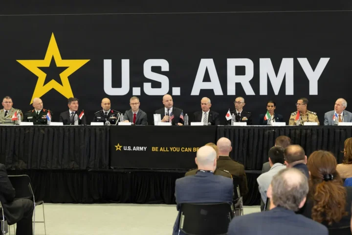 Deputy Under Secretary of the Army Adam Telle with representatives of eight countries at the signing ceremony at AUSA 2026