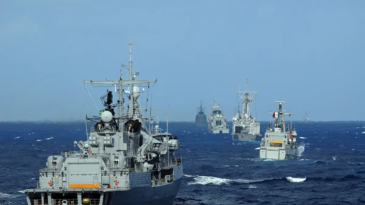 Warships of the U.S. Navy and several Latin American navies, including a Mexican vessel, steaming in formation at sea