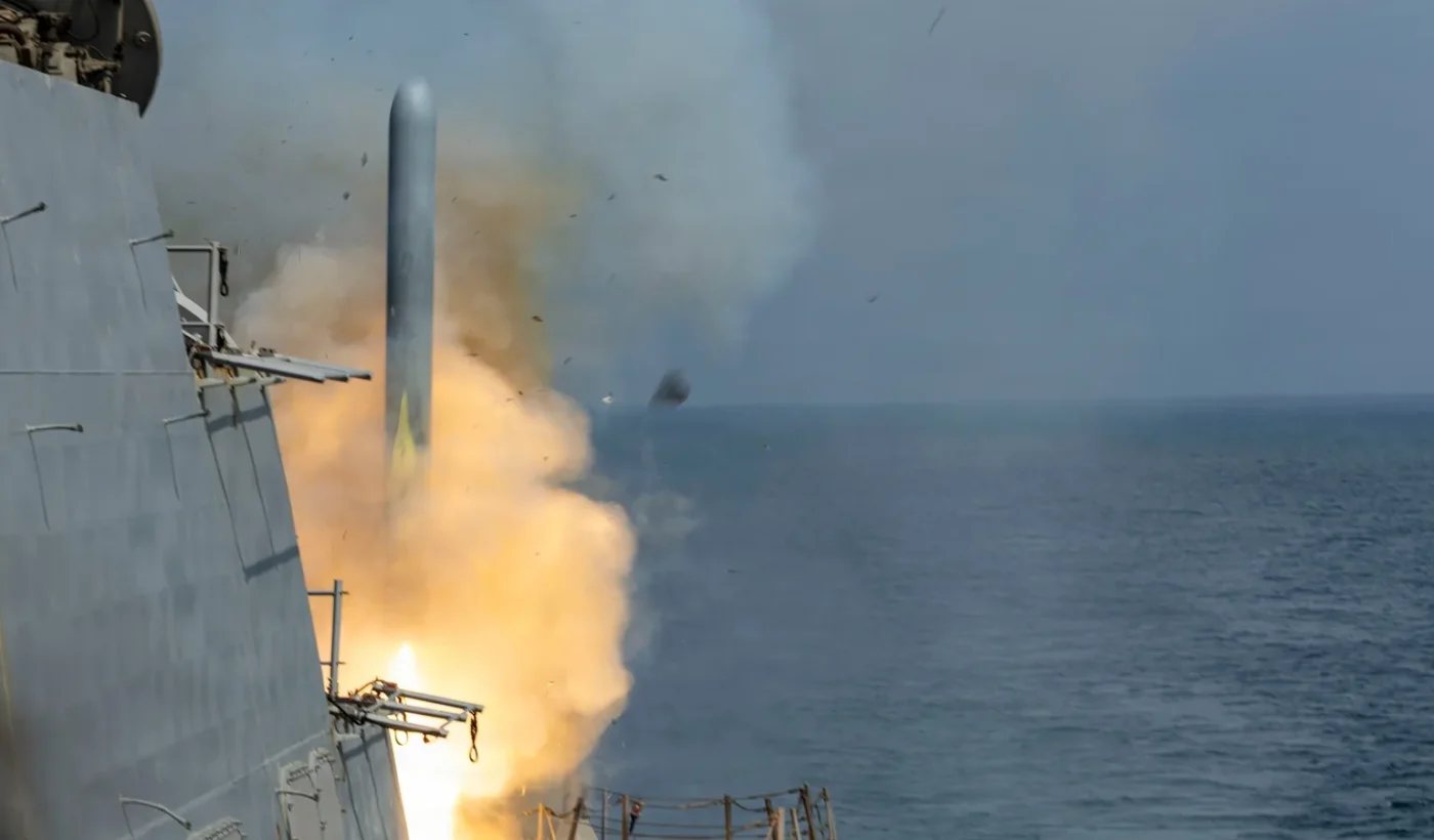 A Tomahawk cruise missile leaves the vertical launching system of the destroyer USS Delbert D. Black in a burst of flame and smoke