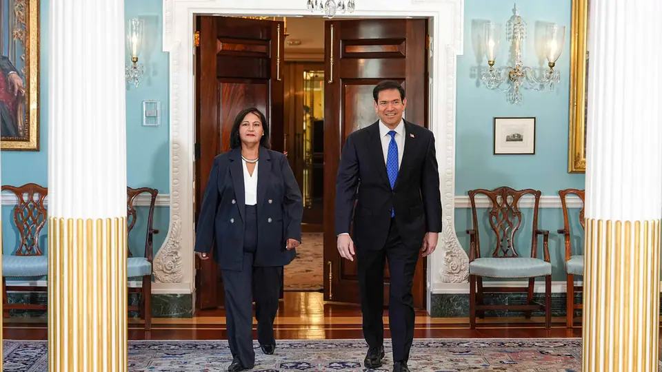 Secretary of State Marco Rubio walks with Dr. Dinorah Figuera, leader of Venezuela's 2015 National Assembly, at the State Department