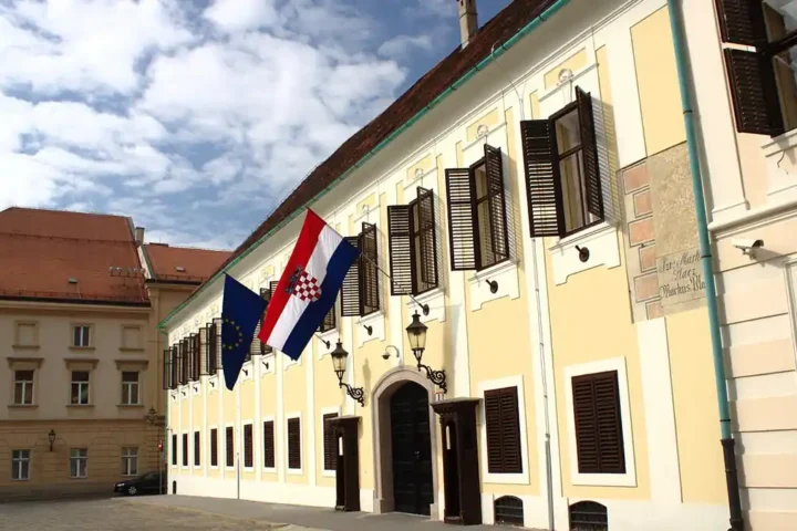 The Banski dvori government building in Zagreb, with the Croatian and EU flags at the entrance