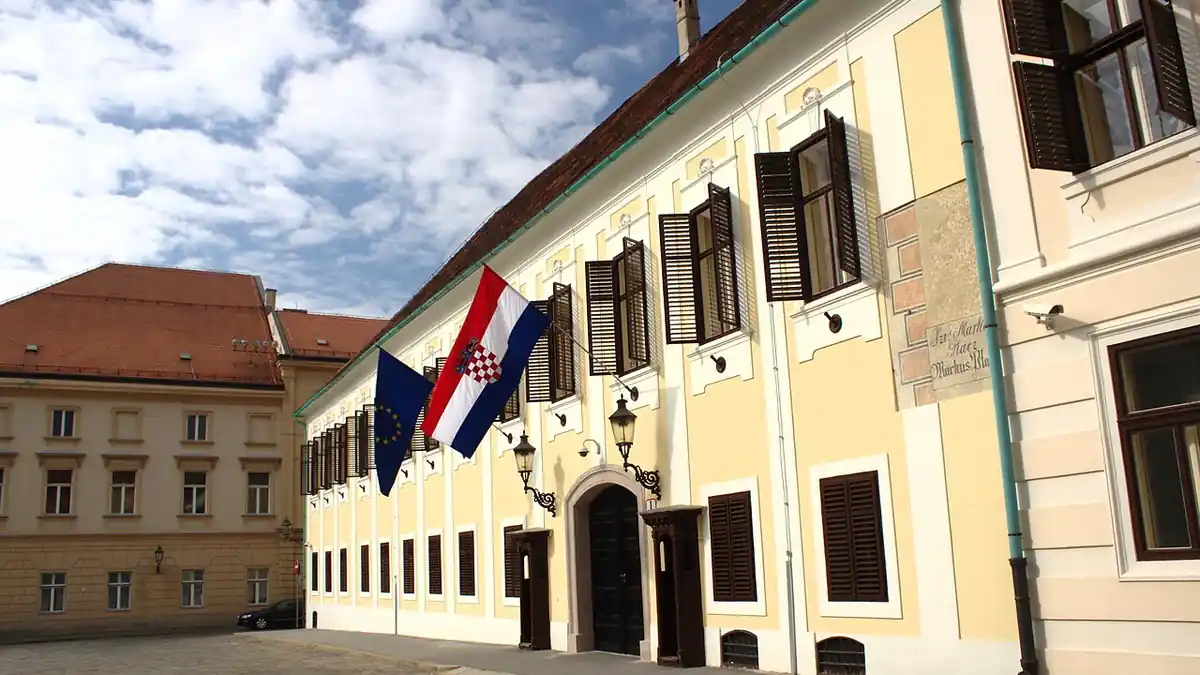 The Banski dvori government building in Zagreb, with the Croatian and EU flags at the entrance