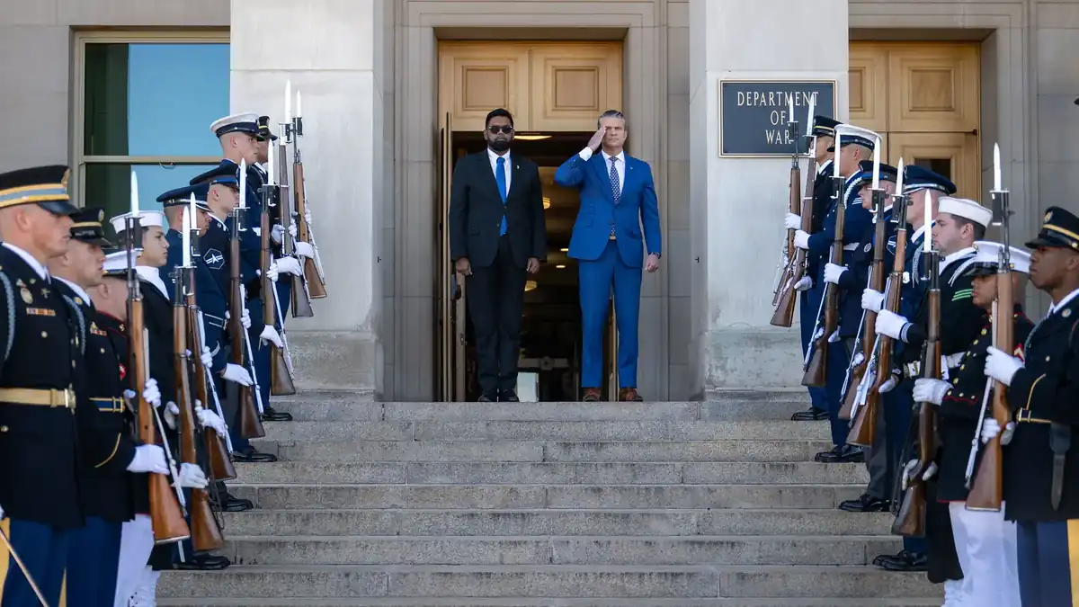 Pete Hegseth and Irfaan Ali at the Pentagon entrance with the Department of War sign