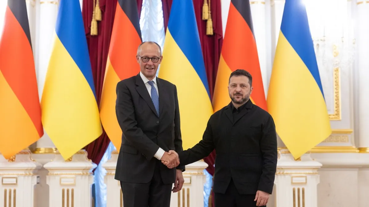 Ukrainian President Volodymyr Zelensky standing with German Chancellor Friedrich Merz in Kyiv