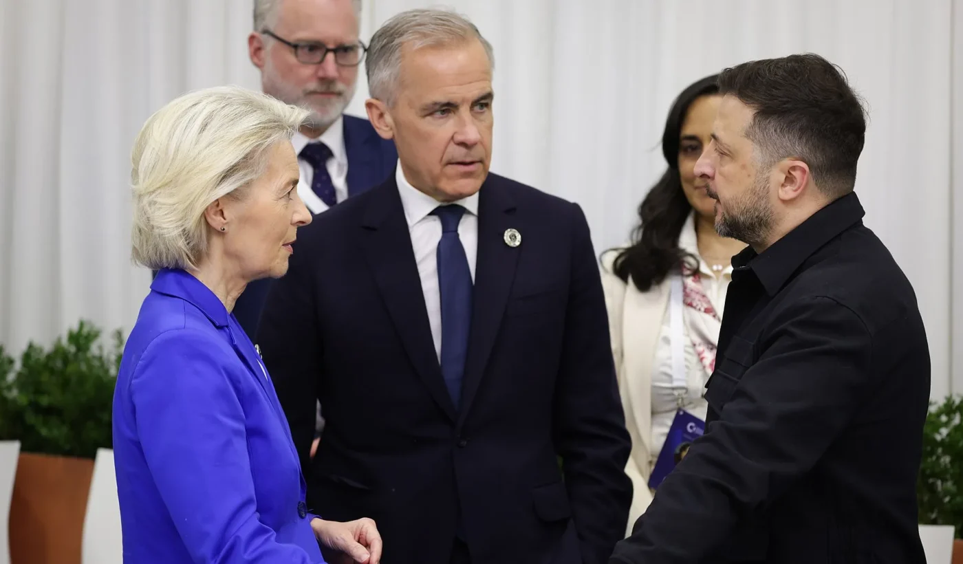 Volodymyr Zelensky, right, talks with European Commission President Ursula von der Leyen and Canadian Prime Minister Mark Carney at the European Political Community summit