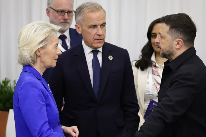 Volodymyr Zelensky, right, talks with European Commission President Ursula von der Leyen and Canadian Prime Minister Mark Carney at the European Political Community summit