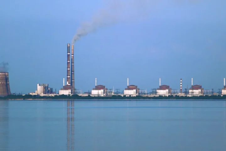 The Zaporizhzhia nuclear power plant seen across the Kakhovka Reservoir, with cooling towers and reactor buildings